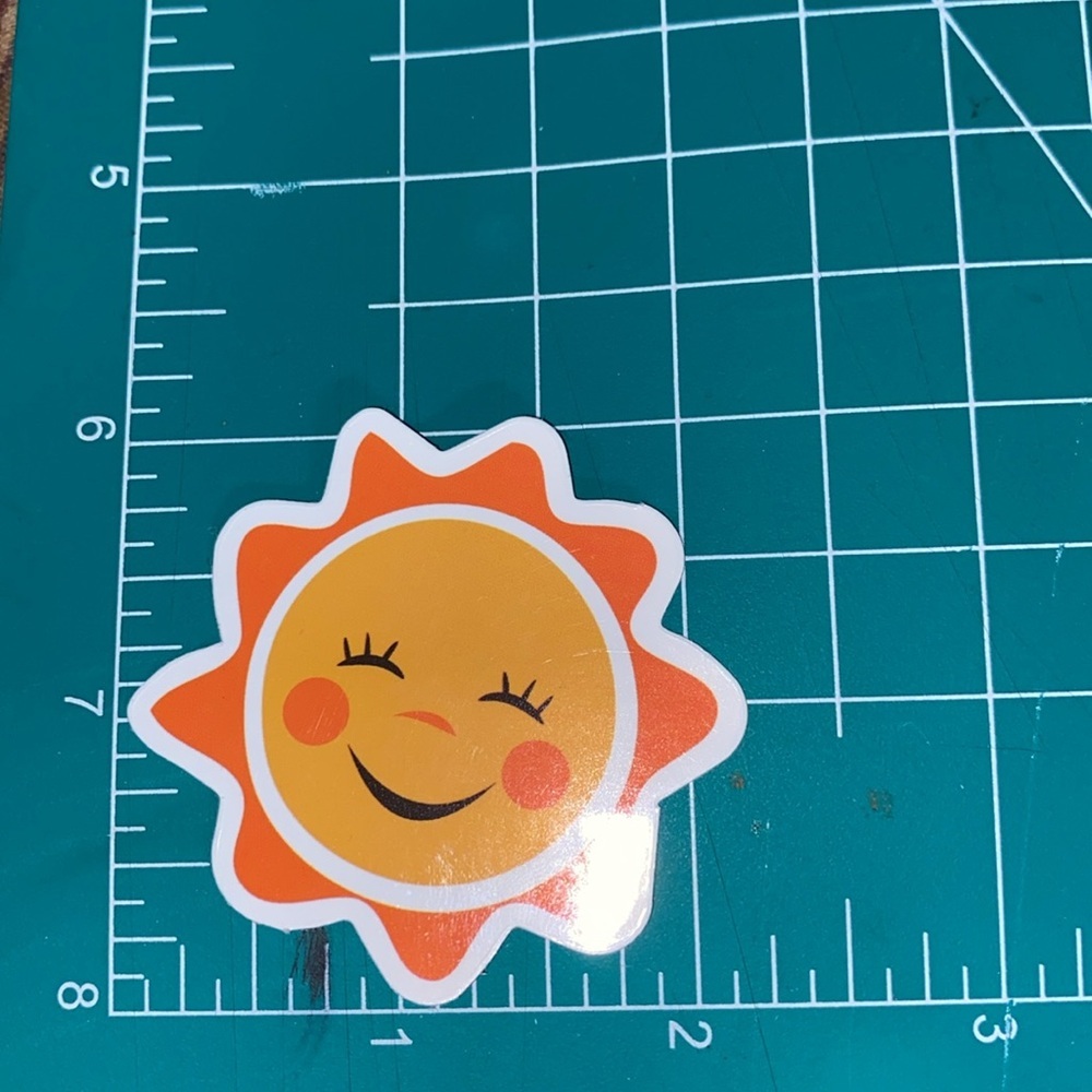 π20/$12π Smiling Sun Sticker - Picture 2 of 3